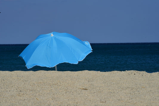 beach umbrella stuck in sand