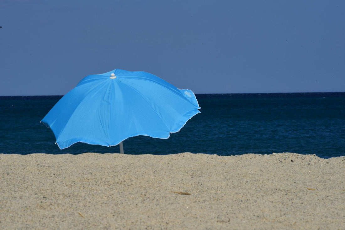 beach umbrella stuck in sand