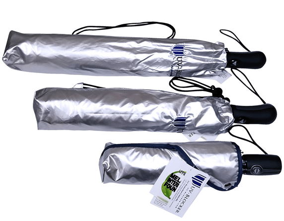 Three closed silver umbrellas.