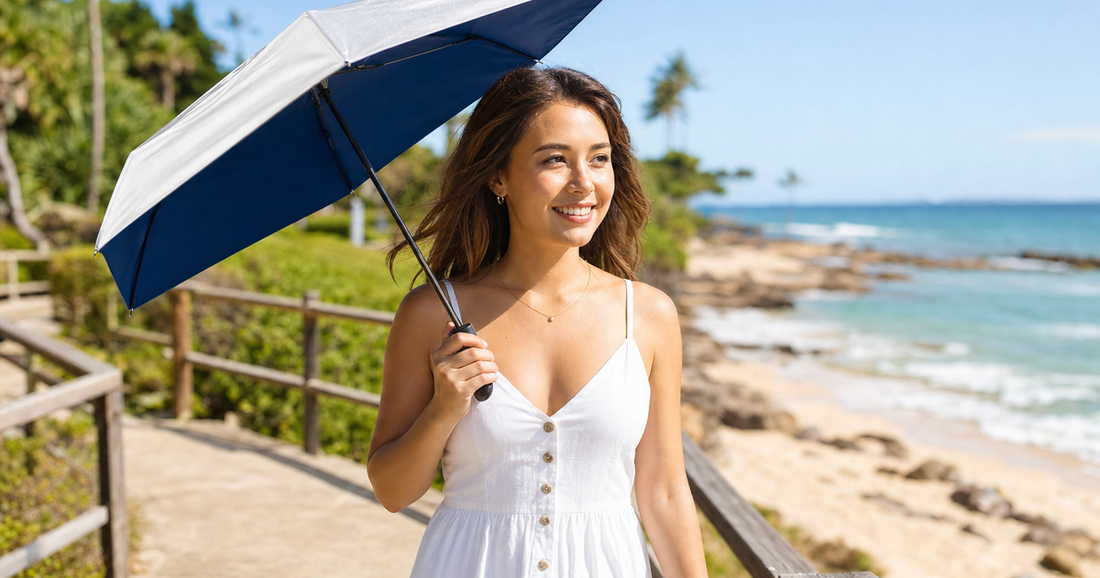 UV-Blocker compact personal sun umbrella in use outdoors — UV Umbrellas vs Sunscreen (What Scientific Research Actually Shows)