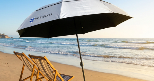 UV-Blocker beach umbrella rental san diego sunny coastline with silver umbrella on sand