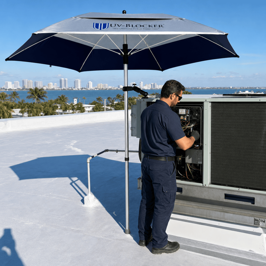 HVAC technician on rooftop using UV-Blocker ServiceShield pole-mounted umbrella for heat and UV safety