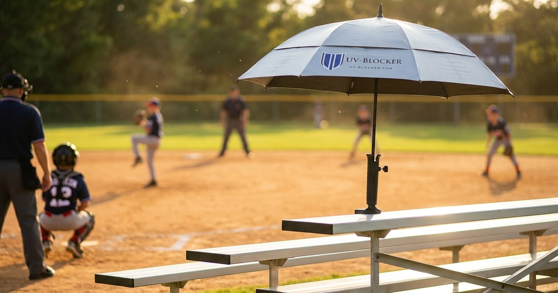 UV-Blocker Sports Umbrella Holder mounted on bleachers at a youth baseball game for hands-free sun protection