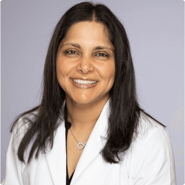 Smiling woman in lab coat - Untitled design 9