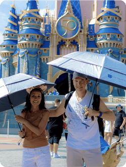Couple at Disney World with umbrellas, June 24, 2025